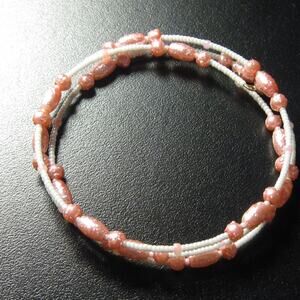 Peachy faux pearl memory wire wrap bracelet
